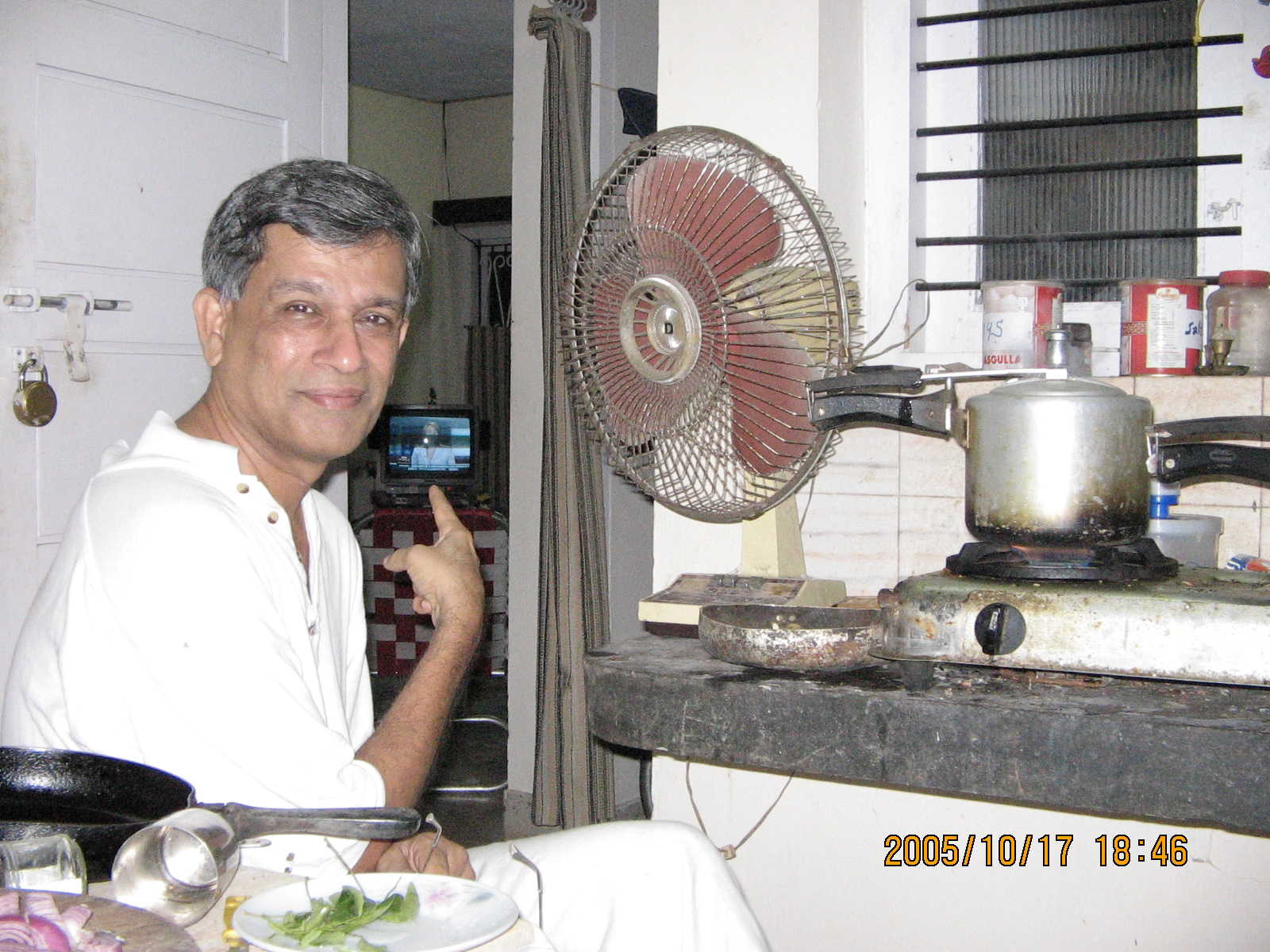 jyothi in his kitchen;  
CLICK ME to see a larger version