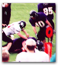 Steve Harwood is tackled just after making a first down