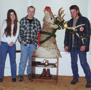 Chris, Adam, And Neta around the Christmas Elk