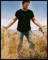 Russell Crowe standing in a field