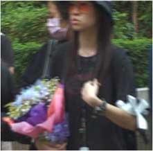 Young Girl With Flowers At Leslie Cheung's Funeral