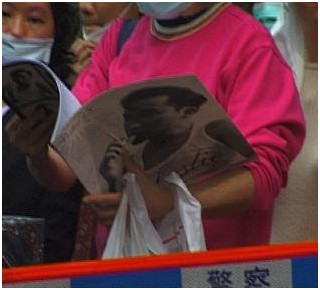 Woman Reading Leslie Commemorative Book