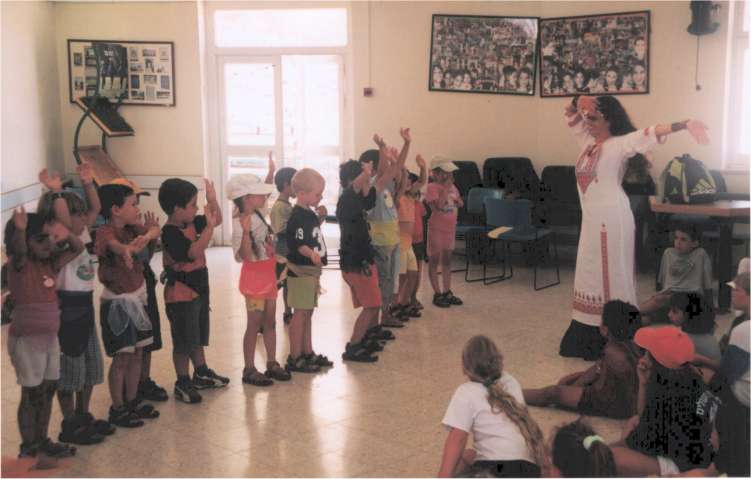 Yael Tal guiding young kids to dance