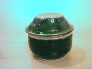Lidded vessel in tenmoku. 3" x 3 3/8".