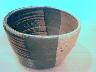 Bowl, with tenmoku and spodumene glazes. 3 1/4" x 4 3/4".