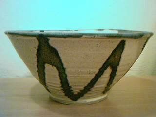 Open bowl, with Penland White and Moshiko glazes, plus cobalt oxide. 4" x 8 1/4".