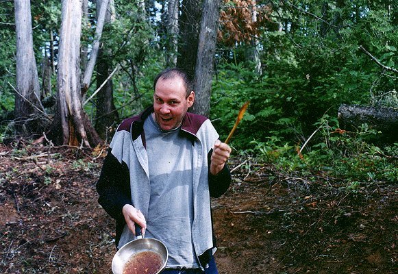 Sylvain prepares food on the camping site, June 25th 2001