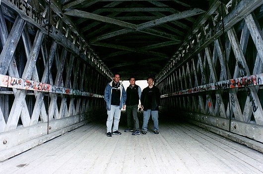 Sylvain, Yin Choy and Chow Sin inside the Narrow bridge, October 2001