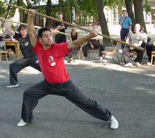 Instructor George is performing Shaolin Long Staff at YMAA Summer Camp 2000