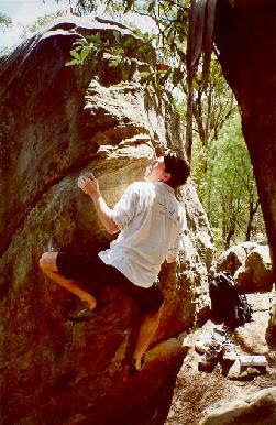 Me working the slopers, preparing for the big move to the high final sloper