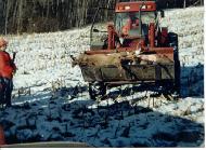 Tractor and Loader - bucket full of deer