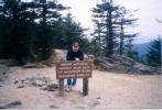 Chris at the sign on top of Mt. Mitchell