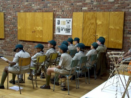 Some of the Scouts eagerly listen to the Troop Scouter to see if they were awarded any trophies.