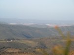 A view of the local surroundings from on top of a nearby mountain ridge. 