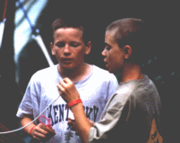 Andrew Rasfeld and Brian Blake examine a heat lashing on some rope