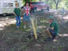 3 Scouts learning to start a fire