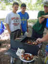Scouts watching shishkabob cooking