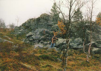 leaning on rock