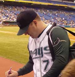 Scott Cursi signs