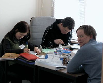 Photo of reporting team at work
