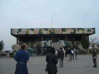 Dora, a khaki-painted building