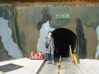 I stand outside the tunnel