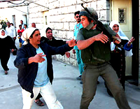 Arab woman confronting Israeli soldier