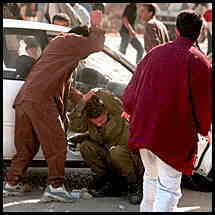 Israeli soldier being beaten
