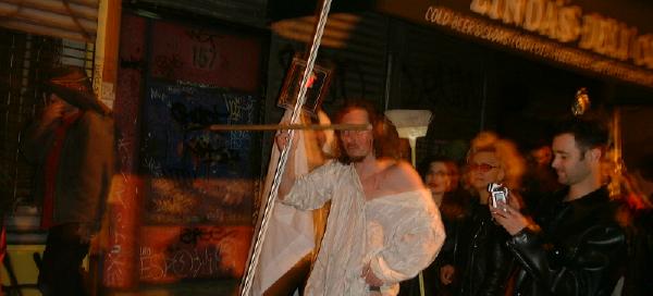 Christ leads small procession from the grave of poetry- photo by artandpolitics.com