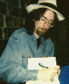Spider Robinson signing an autograph.