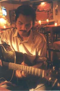 Tuk on guitar