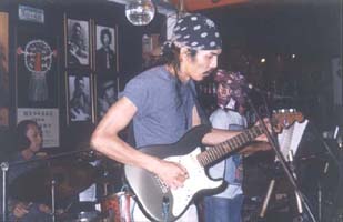 Tuk on guitar