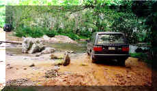 Bob and Jan crossing the Cangandi River