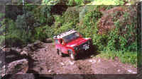 Juan Carlos up a muddy hill with his 300 Tdi