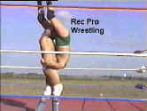 He continues the vicious attack by slamming The Sheriff to the mat..