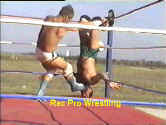 With his adversary trapped and upside down in a corner, Brick delivers a boot to the throat.