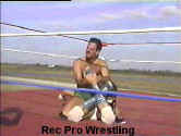 The Sheriff on top with a leglock.