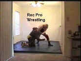 J.P. takes immediate control with a crushing headlock on Larry.
