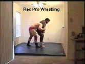 Larry turns the tables with a side headlock of his own.