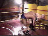 Chuck catches Alex in a headlock