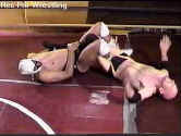 Alex Carr clamps on a figure-4 leglock