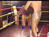 Ringmaster prepares a suplex.