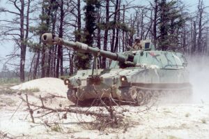 C Battery Gun Chief moving his M109A5 (155mm) Howitzer into position - Charlie Battery