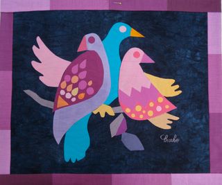 Textile art from "Endangered Species" by Jean Burke.