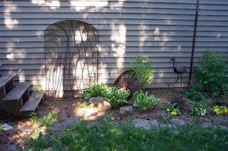 Gate and yard bird by Otto Bacon